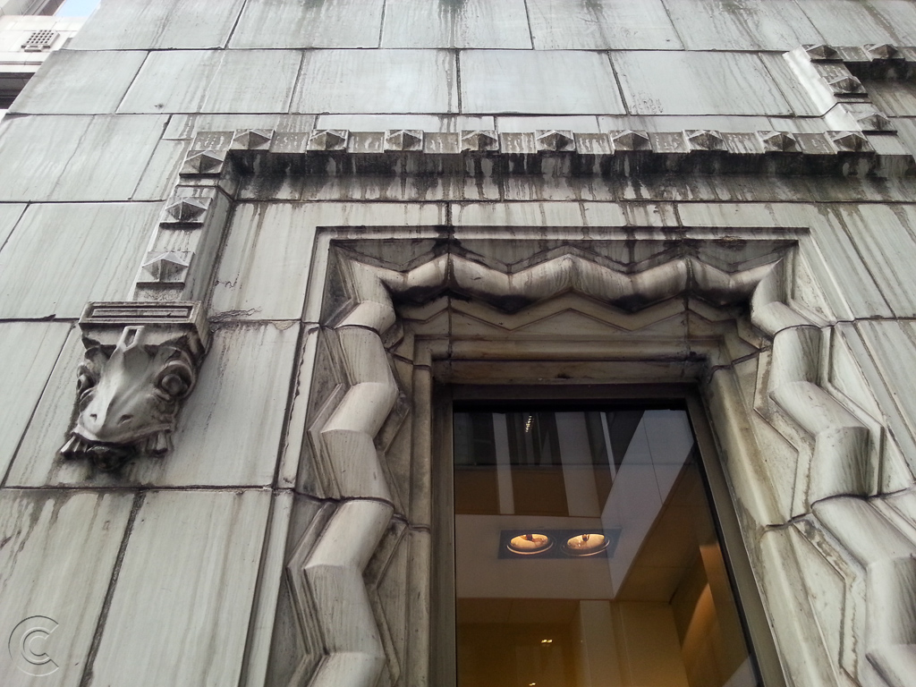 51-54 Gracechurch Street decorative window featuring Beak-head stops