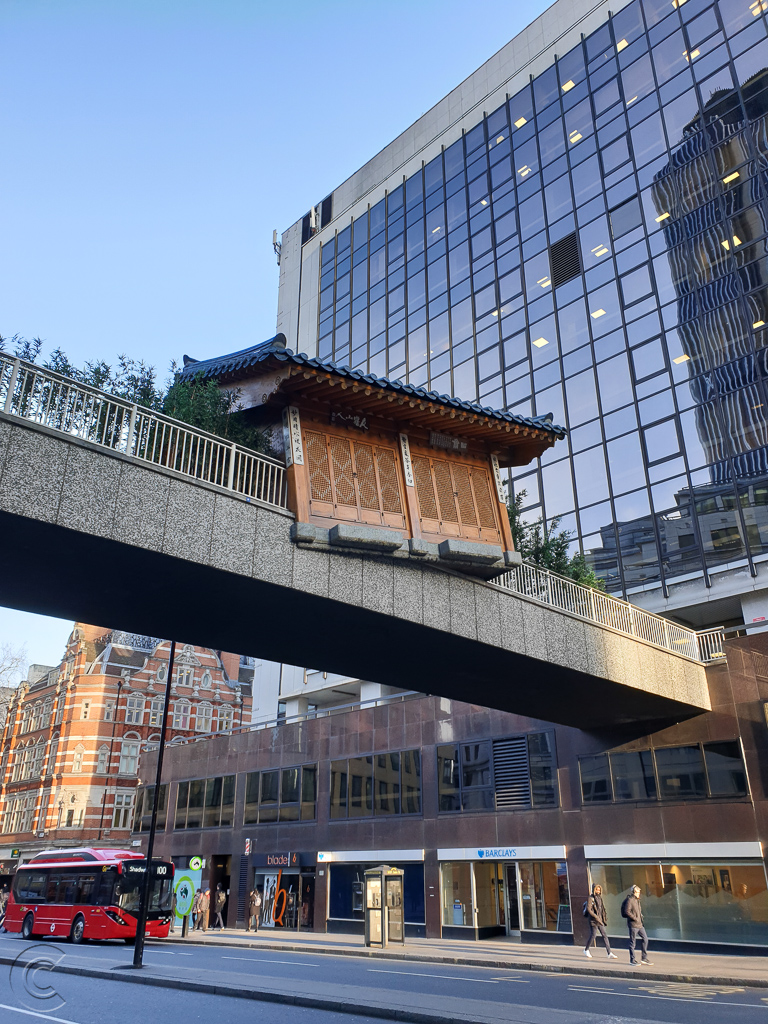 Bridge over Wormwood Street featuring "Bridging Home" by Du Ho Suh.